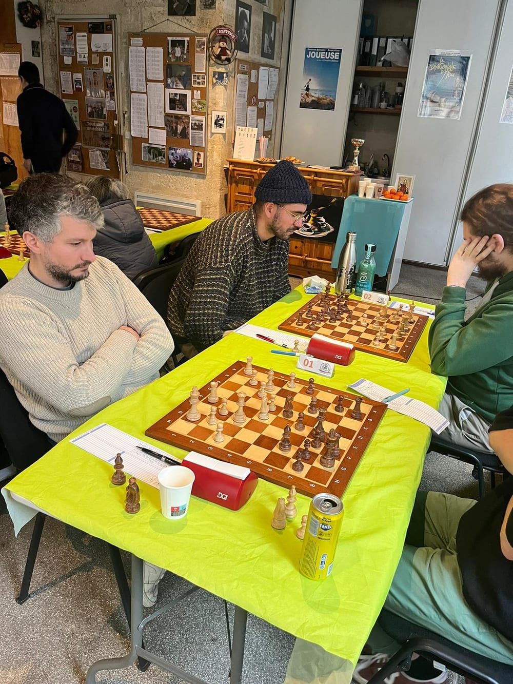 Two players facing off during a team chess match at a club